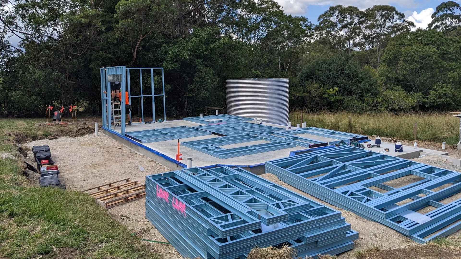 Steel wall frames ready for assembly during granny flat construction
